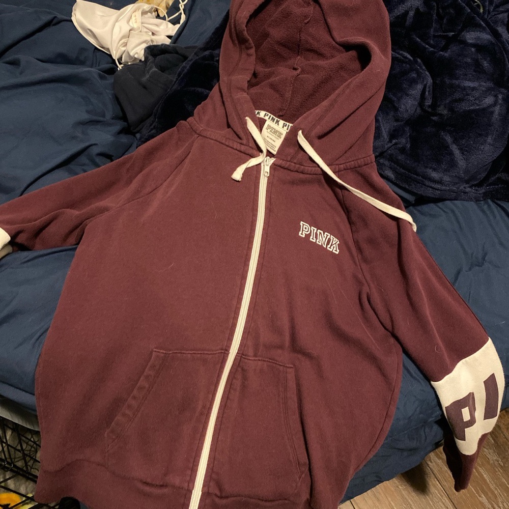 Pink zip up hoodie.